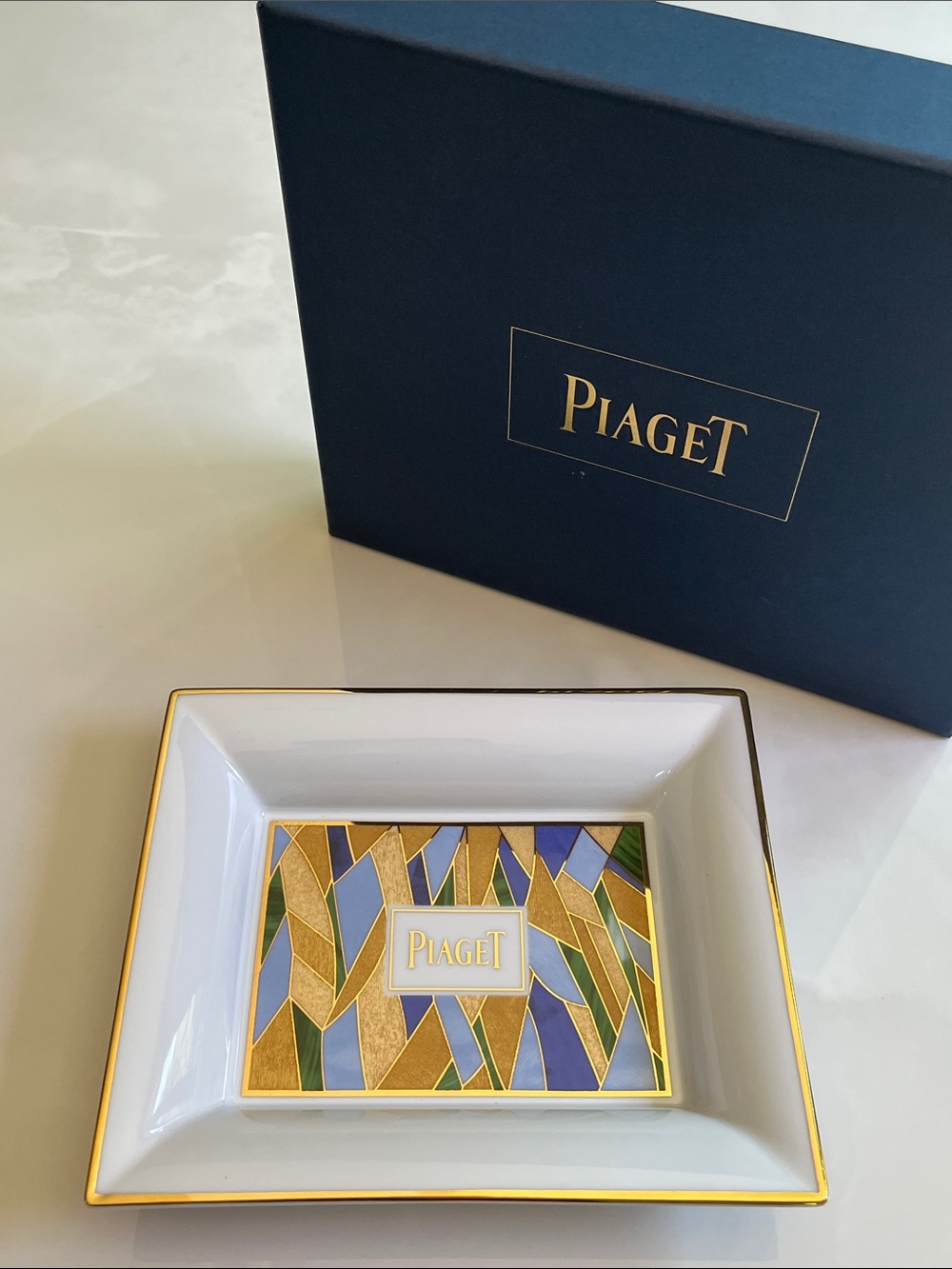 PIAGET Porcelain Trinket Dish. Oversized, geometric, gold trim, new in box.
